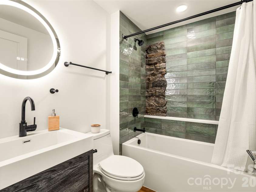 4 Roberts Street, Asheville, NC 28801.  MLS# CAR4419895, YatesRealty ID 48950. Main level bathroom.