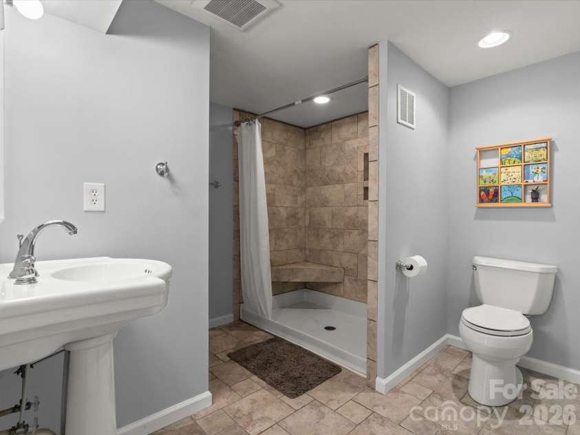 110 Aurora Drive, Asheville, NC 28805.  MLS# CAR4418435, YatesRealty ID 48958. Large lower level full bathroom