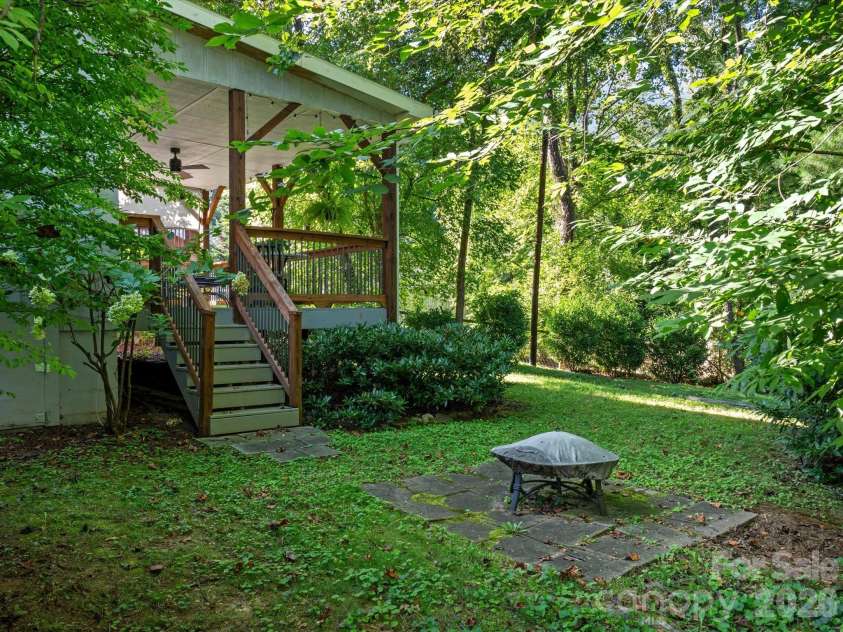 110 Aurora Drive, Asheville, NC 28805.  MLS# CAR4418435, YatesRealty ID 48958. Private fire pit space among the trees