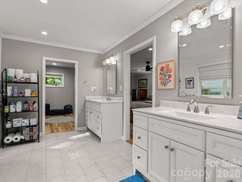 110 Aurora Drive, Asheville, NC 28805.  MLS# CAR4418435, YatesRealty ID 48958. The en suite bathroom features double, split vanities