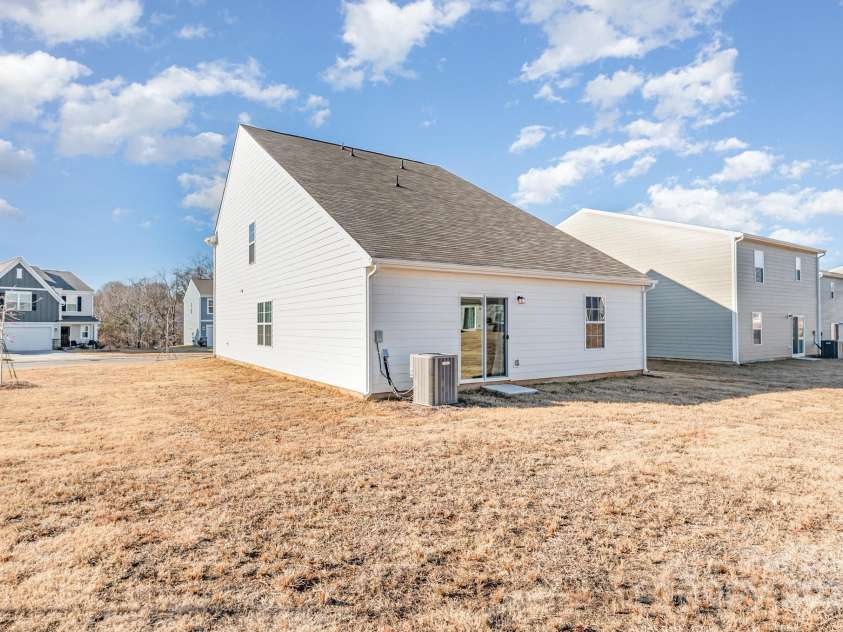 150 Mountain Bridge Way, Statesville, NC 28625.  MLS# CAR4330213, YatesRealty ID 4896. Backyard with small patio area