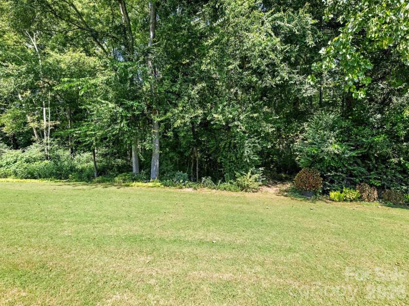 7000 Hemby Commons Parkway, Indian Trail, NC 28079.  MLS# CAR4421495, YatesRealty ID 48971. Private rear yard with tranquil surroundings