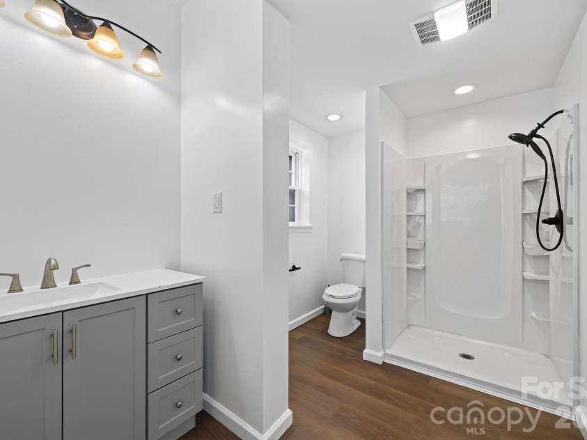 2 Independence Boulevard, Asheville, NC 28805.  MLS# CAR4419918, YatesRealty ID 48988. Lower level bathroom recently redone in 2024