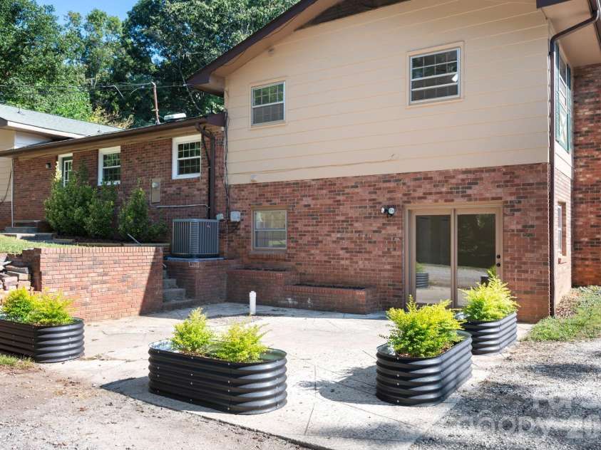 2 Independence Boulevard, Asheville, NC 28805.  MLS# CAR4419918, YatesRealty ID 48988. Spacious back patio for enjoying the outdoors