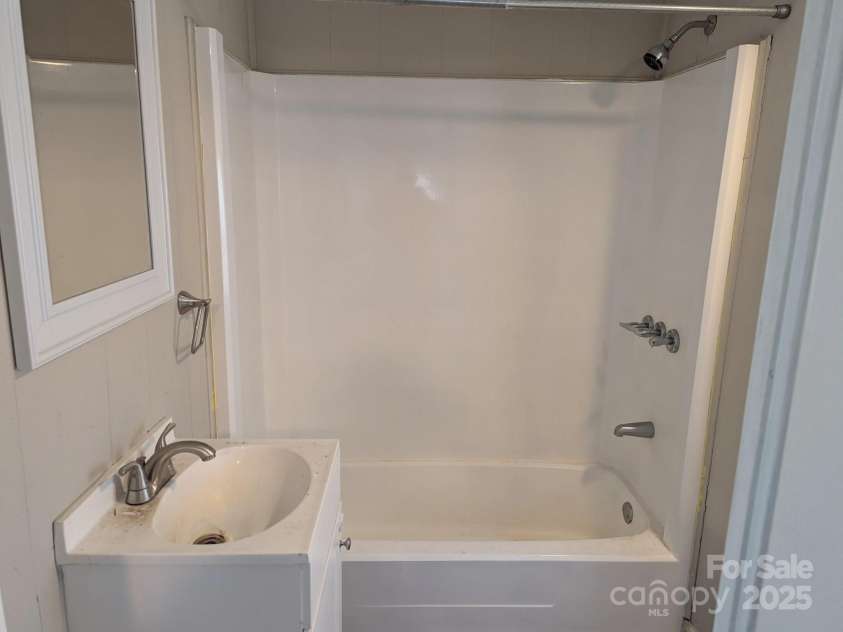 3703 Crawford Street, Gastonia, NC 28052.  MLS# CAR4237431, YatesRealty ID 4900. Bath vanity & tub/shower