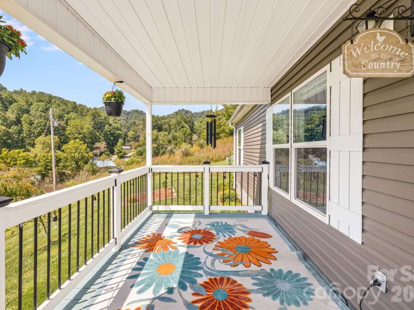 582 John Henry Road, Burnsville, NC 28714.  MLS# CAR4421454, YatesRealty ID 49014. Covered front porch