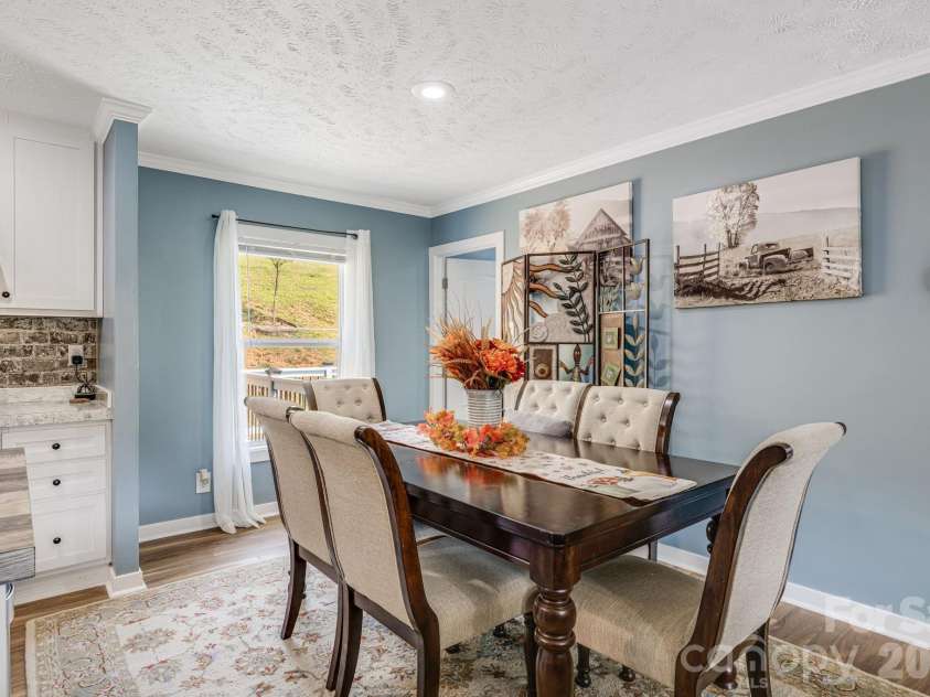 582 John Henry Road, Burnsville, NC 28714.  MLS# CAR4421454, YatesRealty ID 49014. Dining area with natural light
