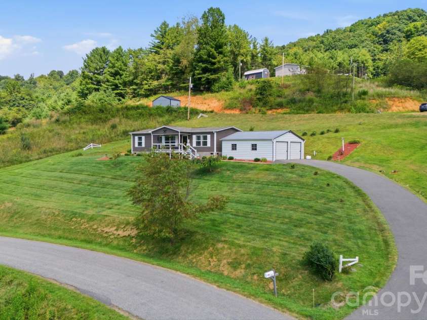 582 John Henry Road, Burnsville, NC 28714.  MLS# CAR4421454, YatesRealty ID 49014. Mountain setting with paved driveway