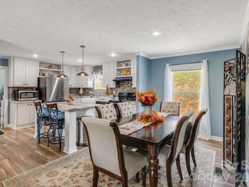 582 John Henry Road, Burnsville, NC 28714.  MLS# CAR4421454, YatesRealty ID 49014. Open dining and kitchen area