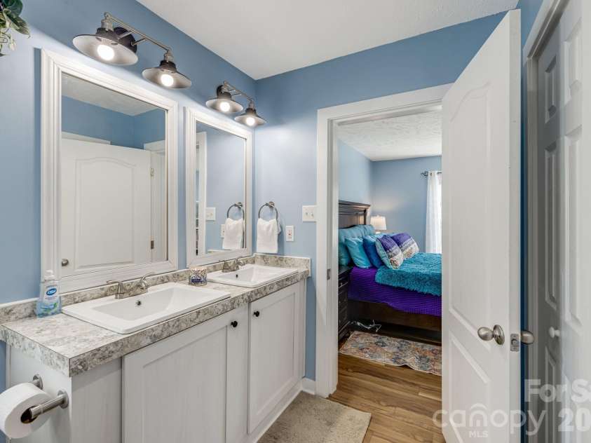 582 John Henry Road, Burnsville, NC 28714.  MLS# CAR4421454, YatesRealty ID 49014. Primary bath with dual vanity