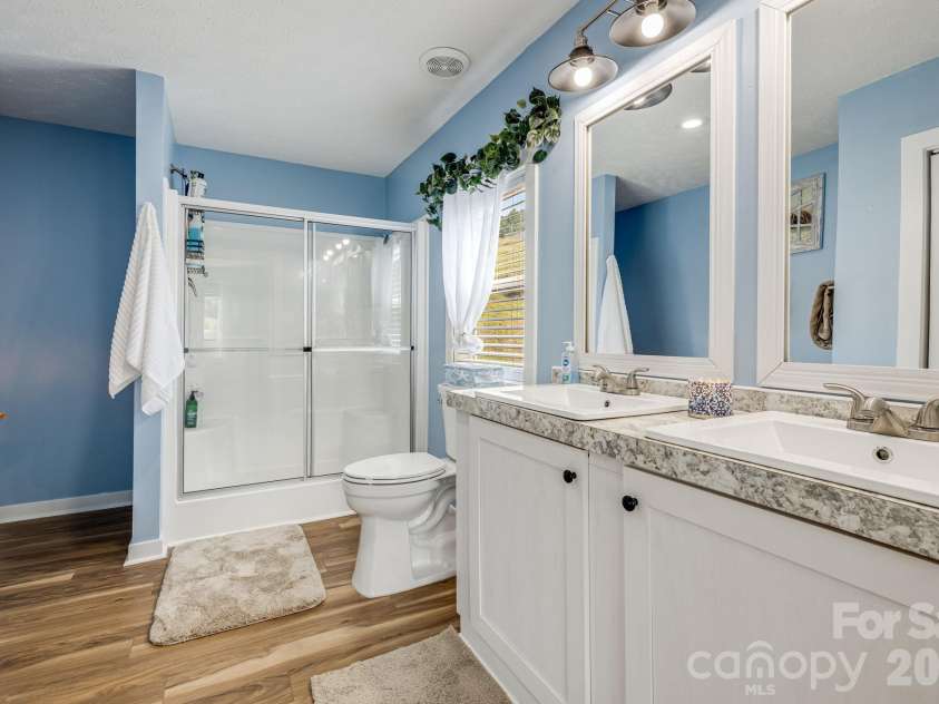 582 John Henry Road, Burnsville, NC 28714.  MLS# CAR4421454, YatesRealty ID 49014. Primary bathroom