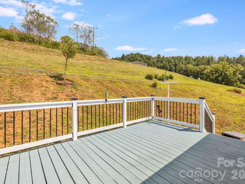 582 John Henry Road, Burnsville, NC 28714.  MLS# CAR4421454, YatesRealty ID 49014. Spacious rear deck