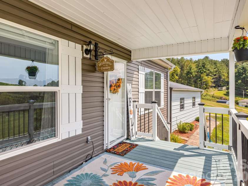 582 John Henry Road, Burnsville, NC 28714.  MLS# CAR4421454, YatesRealty ID 49014. Welcoming front entry