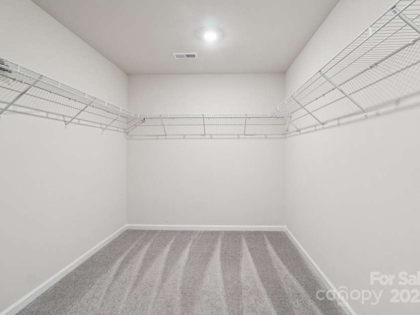 299 Hamptons Cove Road, Troutman, NC 28166.  MLS# CAR4306640, YatesRealty ID 4904. Enormous Walk-In Owner’s Closet 