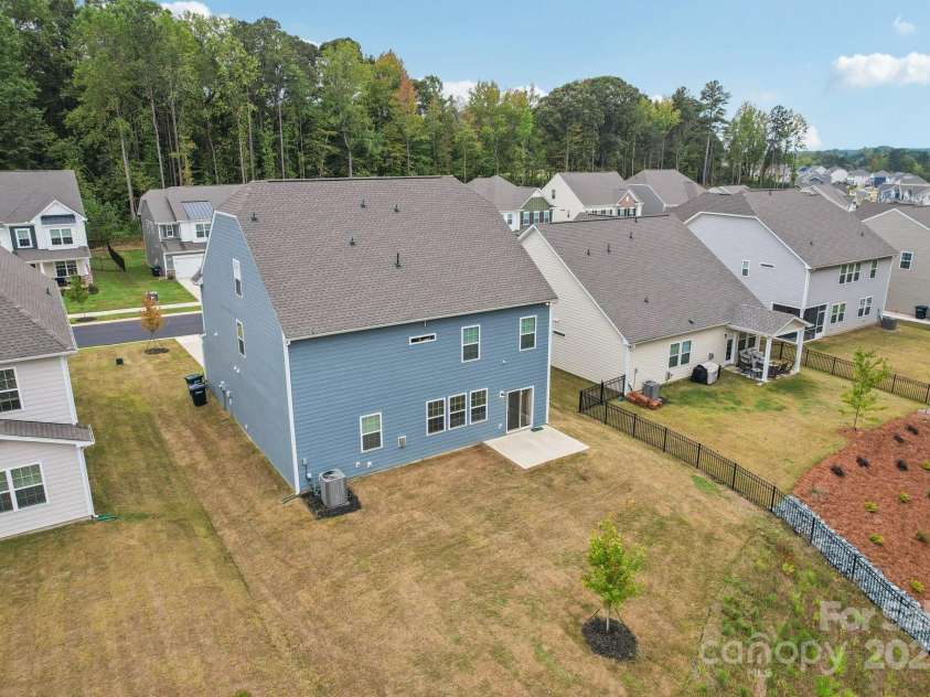 299 Hamptons Cove Road, Troutman, NC 28166.  MLS# CAR4306640, YatesRealty ID 4904. Expensive backyard overlooking wooded area