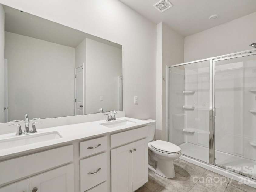 299 Hamptons Cove Road, Troutman, NC 28166.  MLS# CAR4306640, YatesRealty ID 4904. Main Level Bathroom 