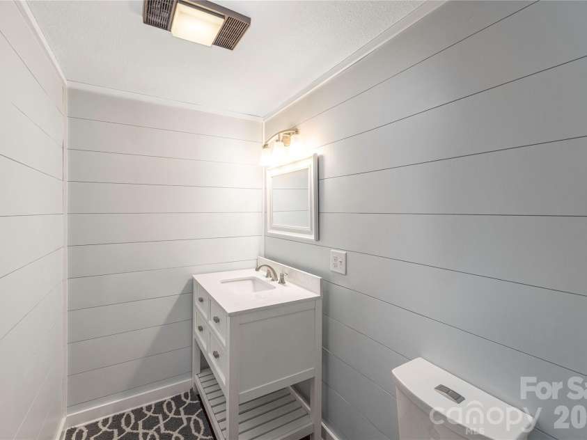 477 Locust Drive, Maggie Valley, NC 28751.  MLS# CAR4420658, YatesRealty ID 49040. Downstairs half bath