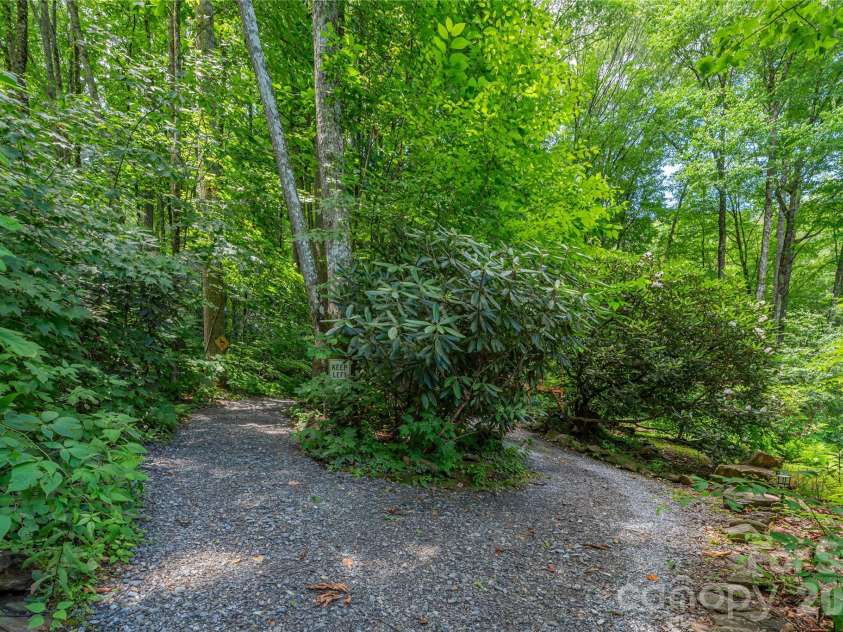 477 Locust Drive, Maggie Valley, NC 28751.  MLS# CAR4420658, YatesRealty ID 49040. Path to cabin