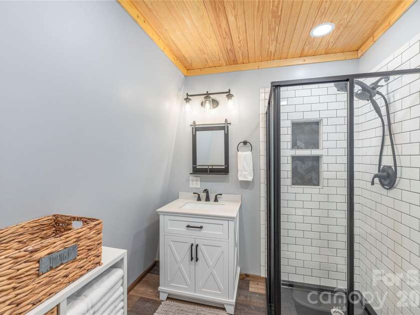 477 Locust Drive, Maggie Valley, NC 28751.  MLS# CAR4420658, YatesRealty ID 49040. Primary bedroom en suite bathroom