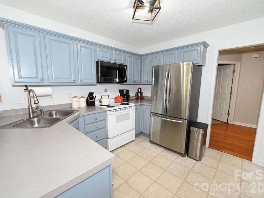 236 17th Avenue, Hickory, NC 28602.  MLS# CAR4421627, YatesRealty ID 49043. Kitchen with doorway to the half bath and laundry room