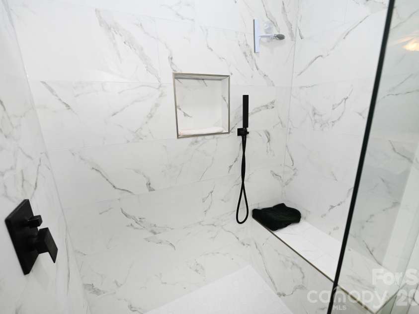 236 17th Avenue, Hickory, NC 28602.  MLS# CAR4421627, YatesRealty ID 49043. Primary shower with bench and niche