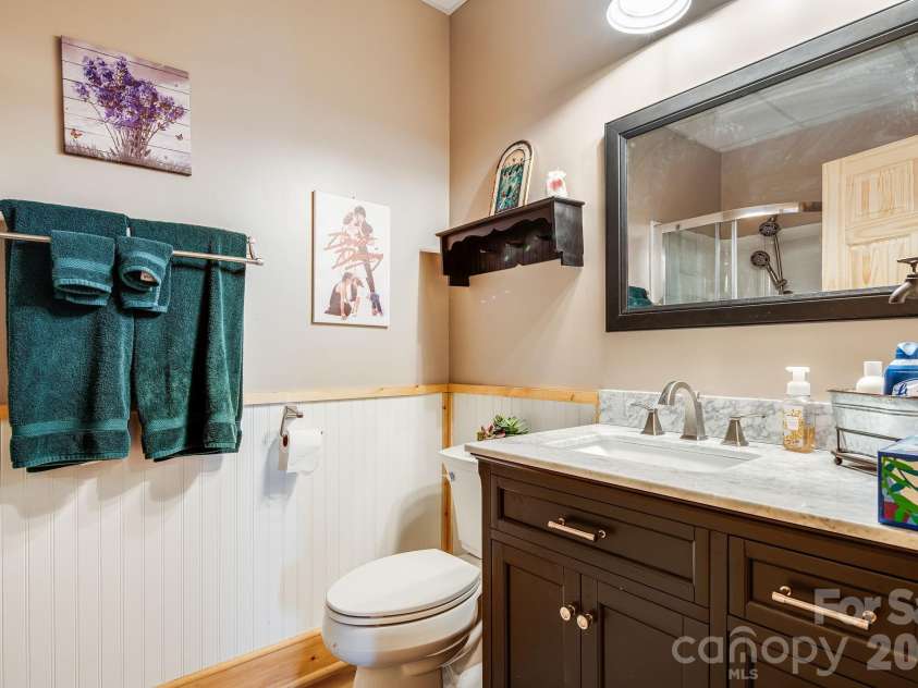158 Raven Boulevard, Lake Lure, NC 28746.  MLS# CAR4335082, YatesRealty ID 4906. Downstairs full bath