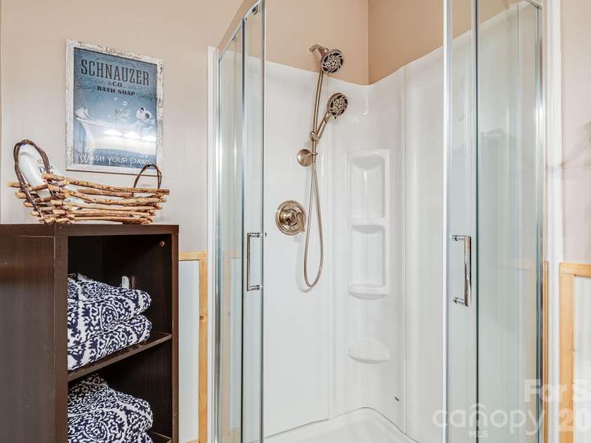 158 Raven Boulevard, Lake Lure, NC 28746.  MLS# CAR4335082, YatesRealty ID 4906. Downstairs full bathroom with shower