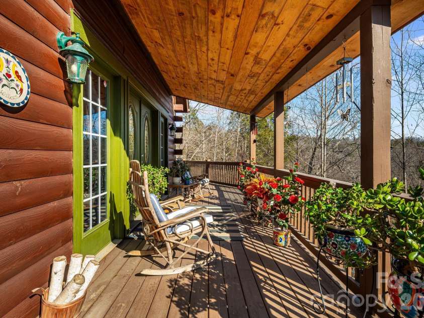 158 Raven Boulevard, Lake Lure, NC 28746.  MLS# CAR4335082, YatesRealty ID 4906. Sit a spell and soak up the sunshine.