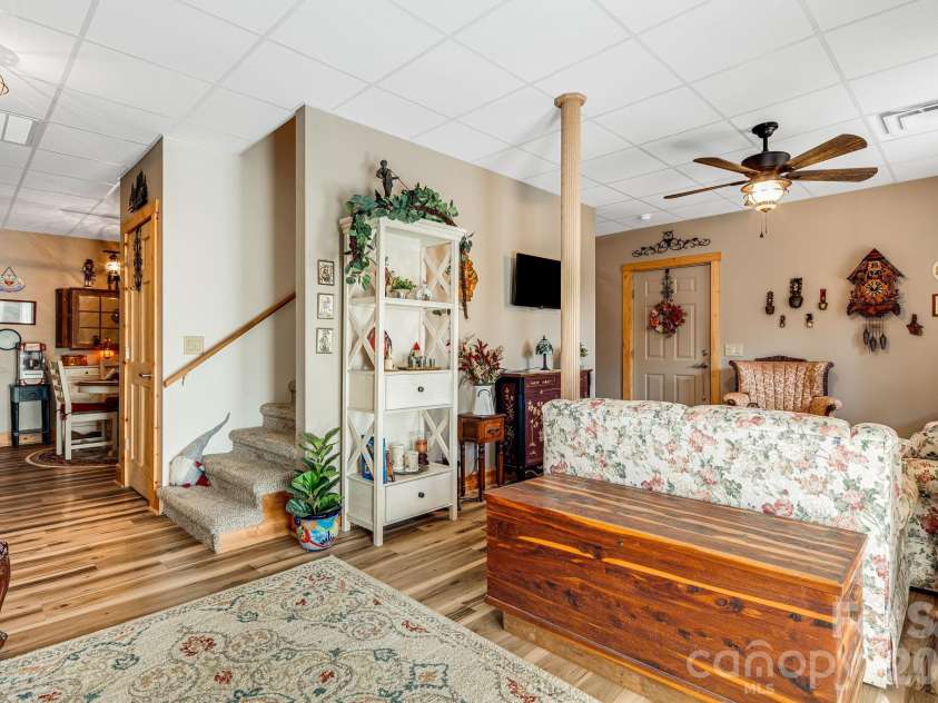 158 Raven Boulevard, Lake Lure, NC 28746.  MLS# CAR4335082, YatesRealty ID 4906. Stairs lead upstairs if not using as a separate space.  Opens to kitchenette/bar area