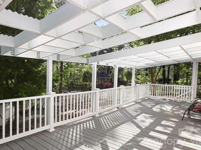 121 Wells Street, Hendersonville, NC 28739.  MLS# CAR4363100, YatesRealty ID 49069. Large front deck with pergola and lights