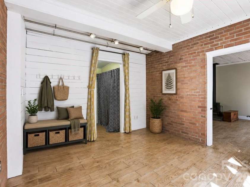 121 Wells Street, Hendersonville, NC 28739.  MLS# CAR4363100, YatesRealty ID 49069. Virtually staged mudroom with heated floors