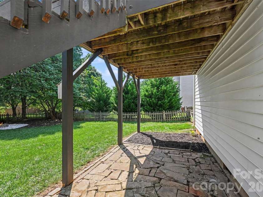 3118 Hadden Hall Boulevard, Fort Mill, SC 29715.  MLS# CAR4420976, YatesRealty ID 49089. Under Deck Patio