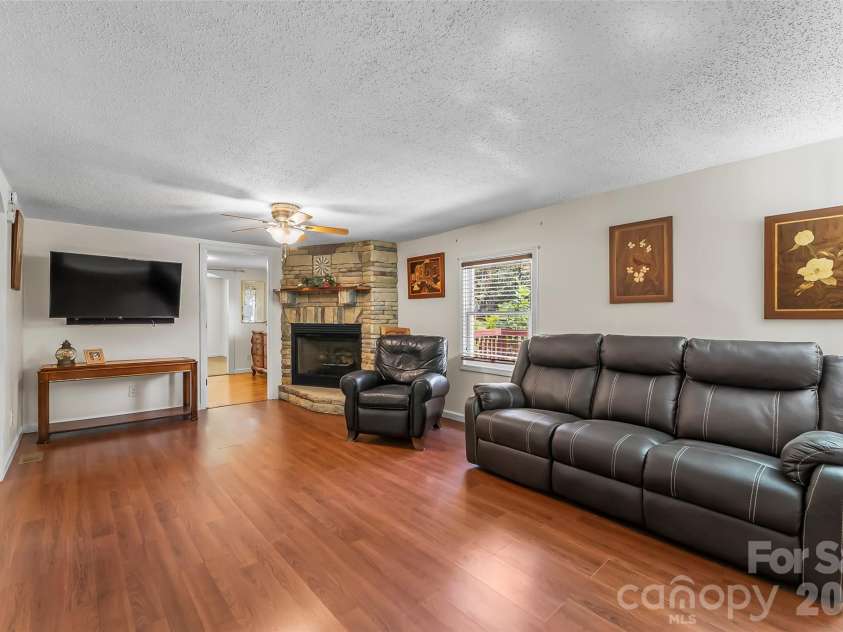 230 JOHNSON HOLLOW Road, Marion, NC 28752.  MLS# CAR4421839, YatesRealty ID 49094. Living room w fireplace