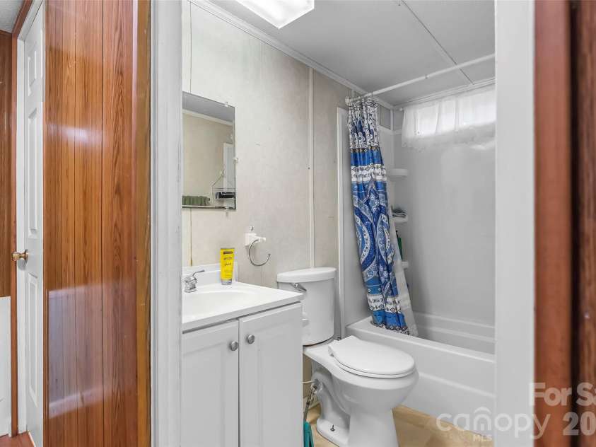 230 JOHNSON HOLLOW Road, Marion, NC 28752.  MLS# CAR4421839, YatesRealty ID 49094. Single wide bathroom