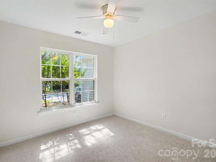 10424 Green Hedge Avenue, Charlotte, NC 28269.  MLS# CAR4421376, YatesRealty ID 49097. Primary Bedroom with Ceiling Fan