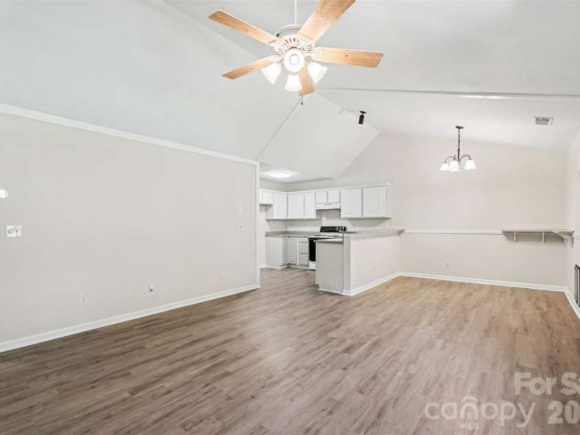 10424 Green Hedge Avenue, Charlotte, NC 28269.  MLS# CAR4421376, YatesRealty ID 49097. Vaulted Ceiling w/ Ceiling Fan, Breakfast/Dining Area Recently Installed Flooring