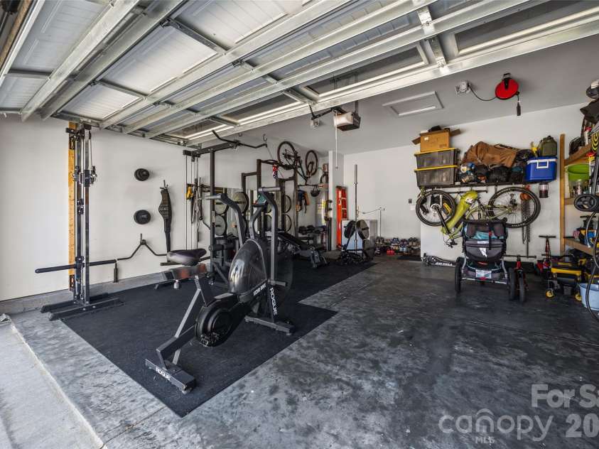 9125 Myrna Drive, Gastonia, NC 28056.  MLS# CAR4421211, YatesRealty ID 49099. 2 car garage utilized as home gym