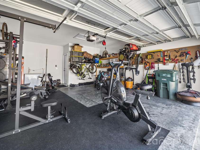 9125 Myrna Drive, Gastonia, NC 28056.  MLS# CAR4421211, YatesRealty ID 49099. 2 car garage utilized as home gym