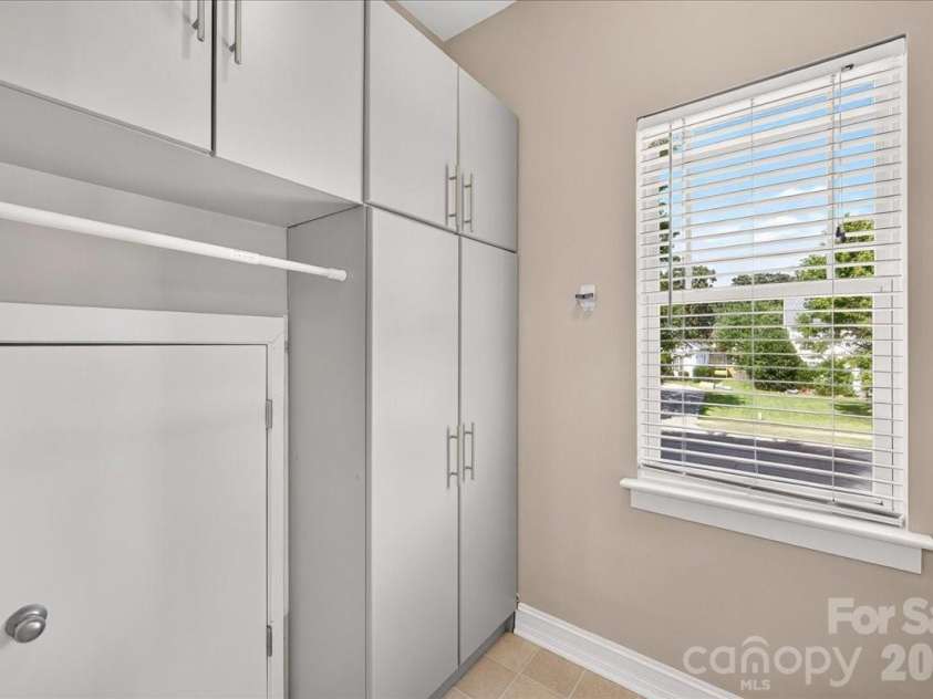 9026 Crusaders Court, Matthews, NC 28105.  MLS# CAR4420940, YatesRealty ID 49102. Additional storage in the laundry room!
