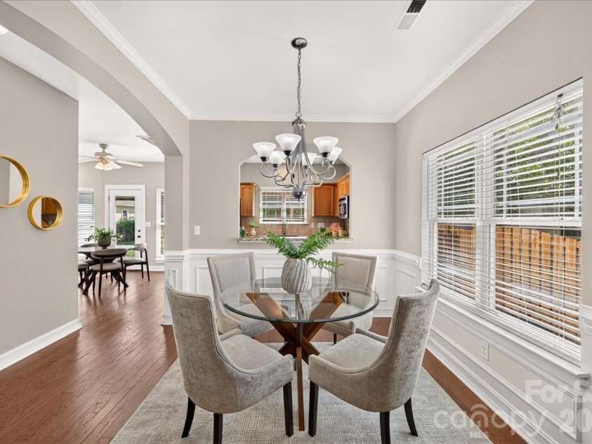 9026 Crusaders Court, Matthews, NC 28105.  MLS# CAR4420940, YatesRealty ID 49102. Large Dining area!