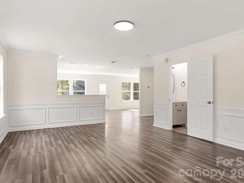 505 Sansberry Drive, York, SC 29745.  MLS# CAR4419779, YatesRealty ID 49124. Living room with view into kitchen, dining and half bathroom