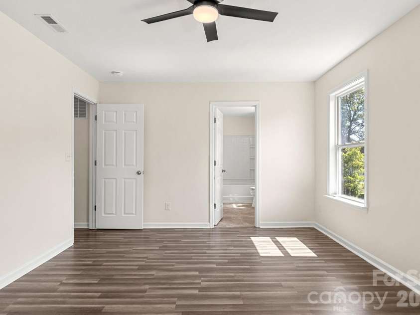 505 Sansberry Drive, York, SC 29745.  MLS# CAR4419779, YatesRealty ID 49124. Primary bedroom with view into ensuite