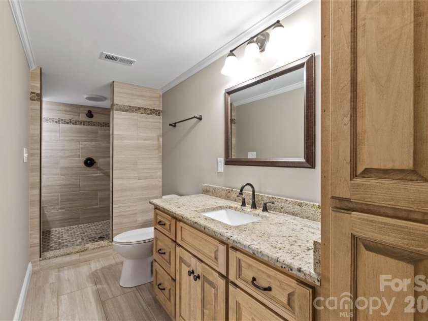 613 Doc Garris Road, Lancaster, SC 29720.  MLS# CAR4419433, YatesRealty ID 49126. Basement bathroom