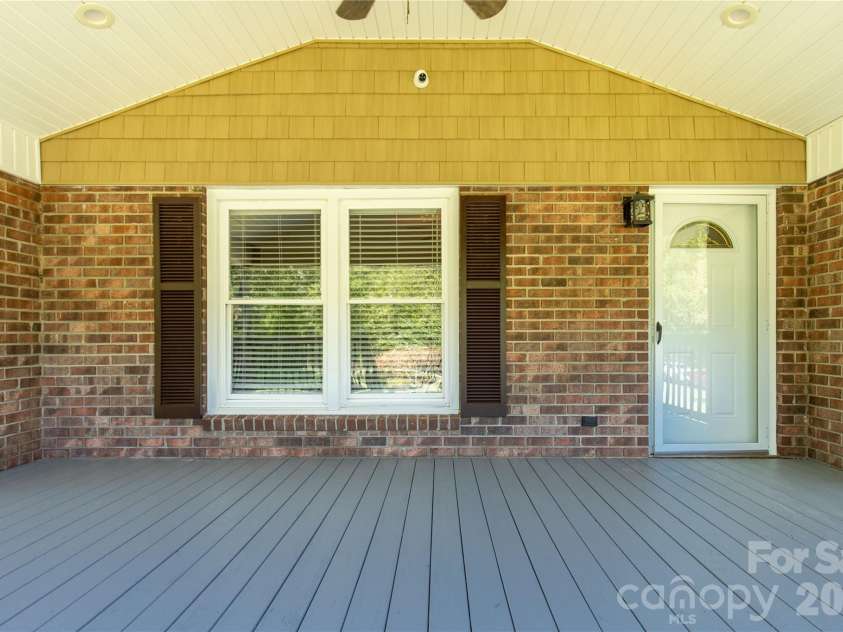 613 Doc Garris Road, Lancaster, SC 29720.  MLS# CAR4419433, YatesRealty ID 49126. Covered front porch