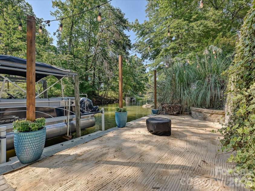 21624 Rio Oro Drive, Cornelius, NC 28031.  MLS# CAR4419384, YatesRealty ID 49127. Sandy Beach Area with Fire Pit
