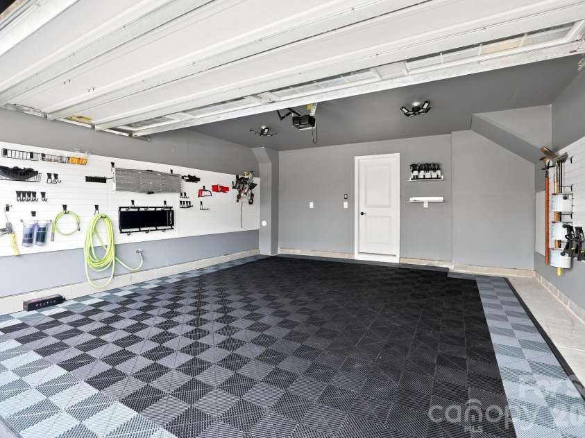 2595 Grantham Place Drive, Fort Mill, SC 29715.  MLS# CAR4418348, YatesRealty ID 49129. Garage Finished Floor with Construction Grade Tile
