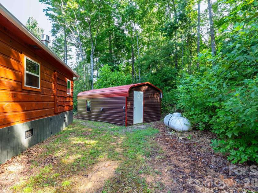 24 Old Berlin Way, Black Mountain, NC 28711.  MLS# CAR4416364, YatesRealty ID 49134. Back Yard, Shed with Power and Laundry