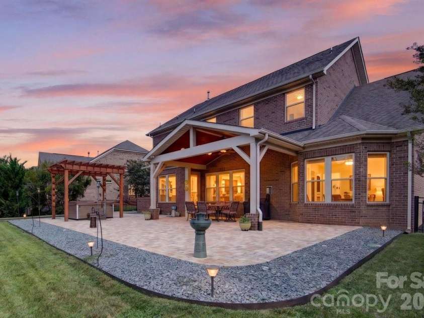 11322 Brangus Lane, Charlotte, NC 28227.  MLS# CAR4414789, YatesRealty ID 49136. Custom covered paver patio
