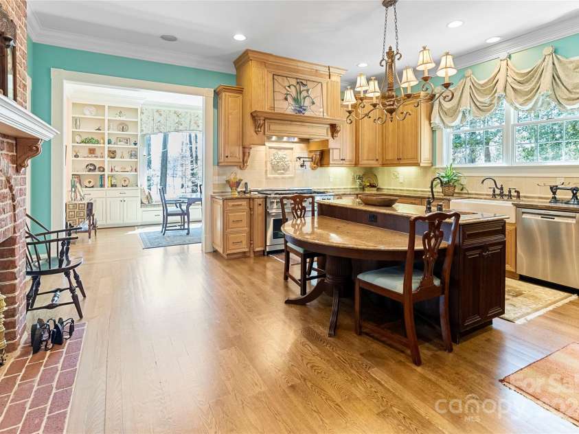 229 Joseph Kershaw Road, Eastover, SC 29044.  MLS# CAR4122309, YatesRealty ID 4915. Gourmet kitchen with brick fireplace