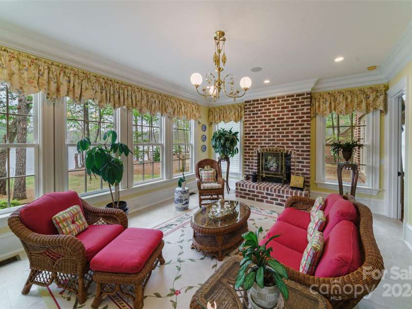 229 Joseph Kershaw Road, Eastover, SC 29044.  MLS# CAR4122309, YatesRealty ID 4915. Sunroom with fireplace and coffee/wet bar with under counter fridge